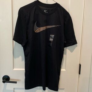 The Nike Tee.‎  Yellow/grey Nike swoosh across the front.